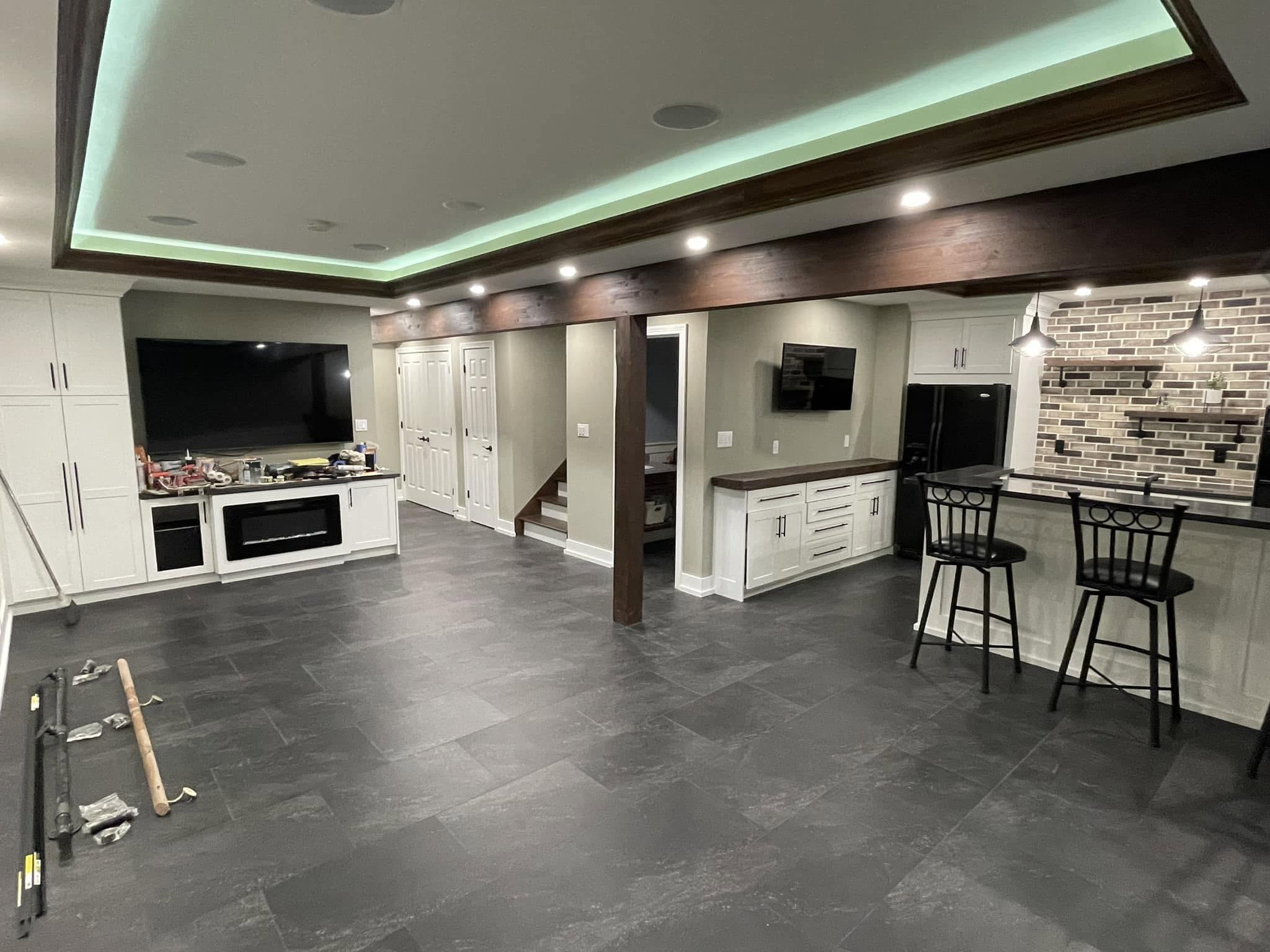 Custom white cabinetry in a finished Greenfield-area kitchen and living space